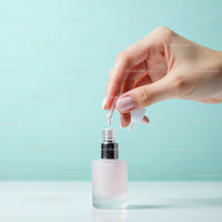 Elegant Woman Applying Pale Pink Nail Polish with Modern Tools