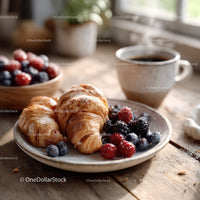 Fresh Croissants with Berries and Coffee on Rustic Wooden Table