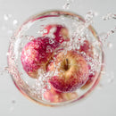 Fresh Red Apples Splashing Water Macro Shot
