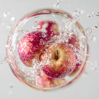 Fresh Red Apples Splashing Water Macro Shot