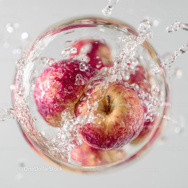 Fresh Red Apples Splashing Water Macro Shot
