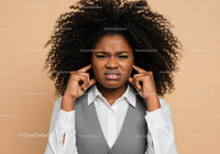 Frustrated Woman Covering Ears with Annoyed Expression