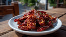 Dried Red Chili Peppers on White Plate in Rustic Setting