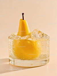 Fresh pear immersed in ice-filled glass on beige