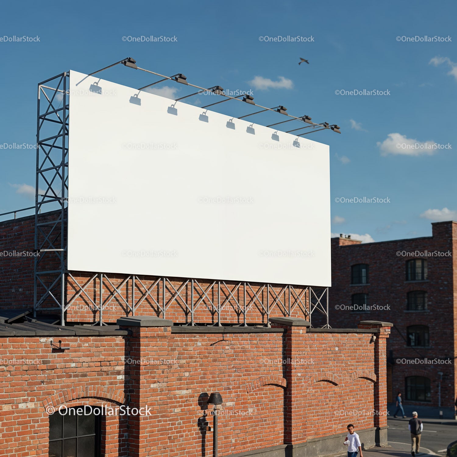 Blank billboard on rooftop above red brick building