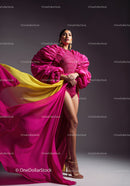 Fashion Model in Vibrant Pink and Yellow Flowing Gown
