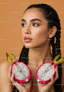 Vibrant Young Woman with Braided Hair Holding Dragon Fruit
