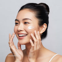 Young Woman Applying Facial Cream with Bright Skin and Glowing Complexion