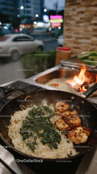 Stir-fried Noodles with Grilled Chicken and Spinach in an Outdoor Pan