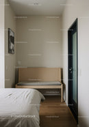 Minimalist Bedroom with Wooden Bench and Neutral Decor