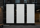 Three Blank Vertical Banners on Urban Building Wall