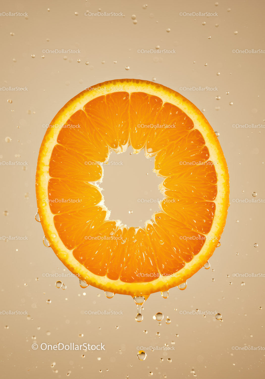 Fresh orange slice with water droplets in motion