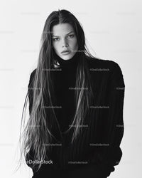 Elegant Female Model in Black Sweater with Long Hair in Studio