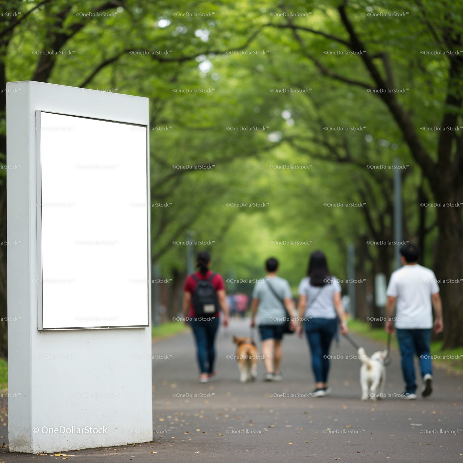 Empty billboard in leafy park with people walking dogs