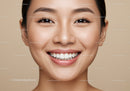 Close up portrait of smiling young woman with clear skin