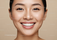 Close up portrait of smiling young woman with clear skin