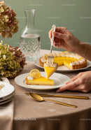 Elegant Lemon Tart Slice with Fresh Lemon on a Fancy White Plate