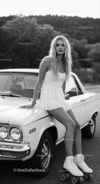 Young woman in white dress with roller skates by car