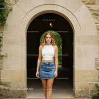 Casual Summer Look of Young Woman in Denim Skirt