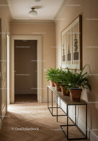 Elegant Hallway with Green Potted Plants and Artistic Decor