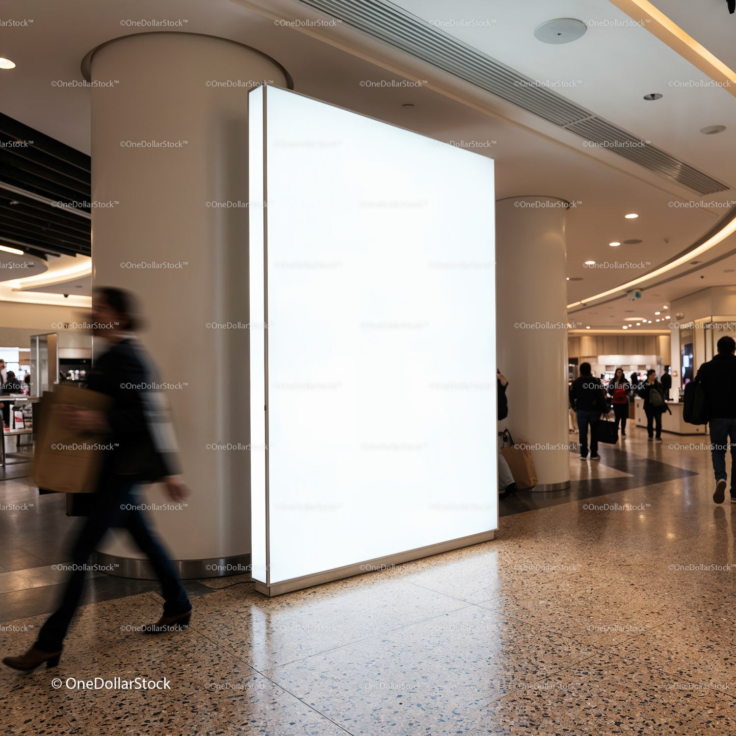 Empty illuminated billboard in busy modern shopping mall
