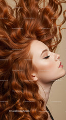 Profile of woman with flowing vibrant red hair