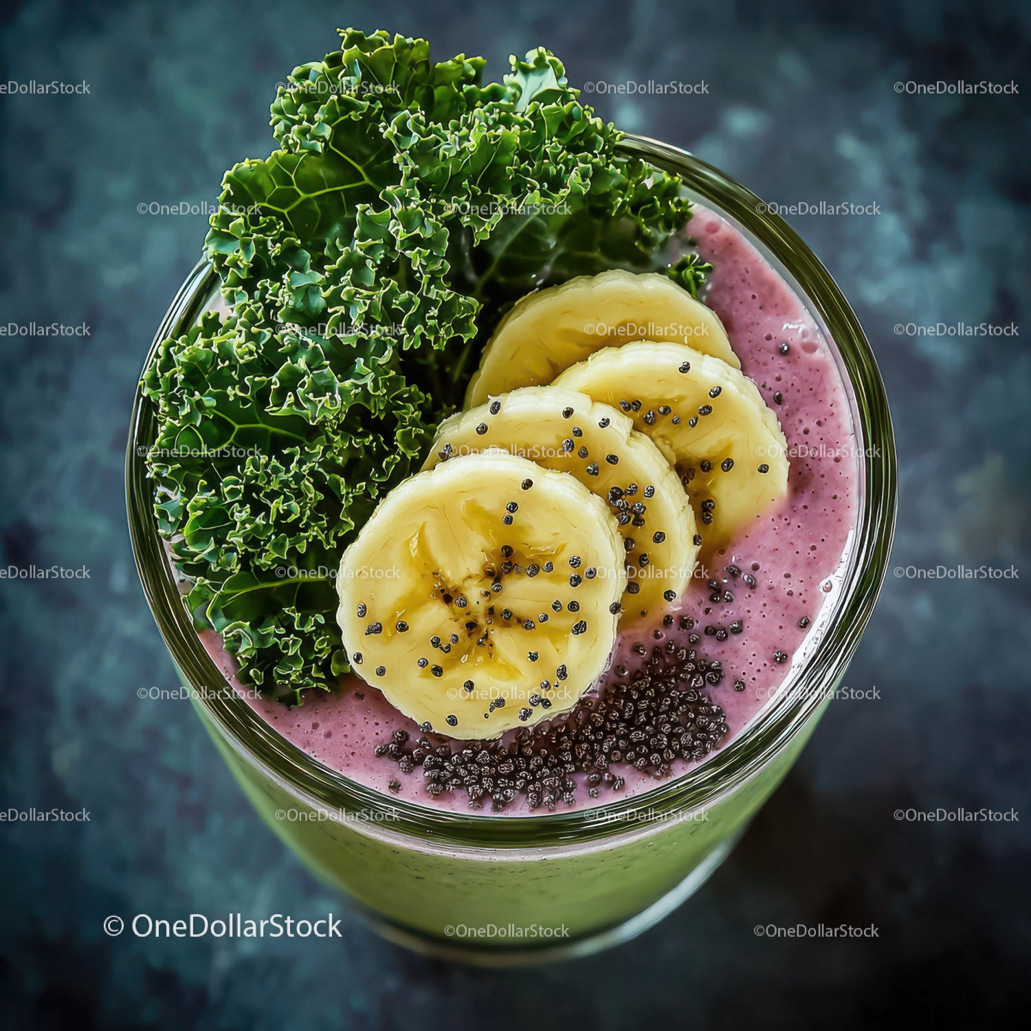 Banana Slices, Kale Leaves, and Berry Smoothie in Glass