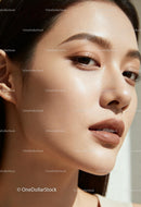 Close-up portrait of young woman with flawless skin