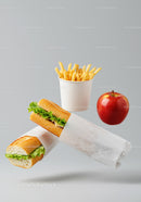 Fresh sandwich meal with fries and red apple