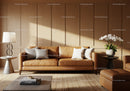 Modern leather sofa with cozy cushions in stylish living room