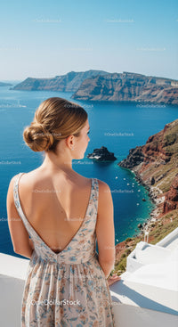 Woman enjoying scenic ocean view from seaside balcony