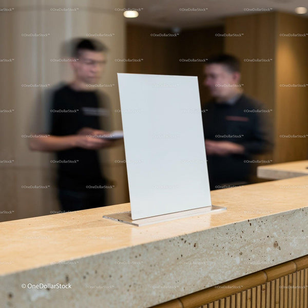 Blank white sign on modern hotel reception desk JPG Mockup Image