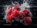 Fresh Red Raspberries Splashing Underwater in Water