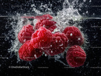 Fresh Red Raspberries Splashing Underwater in Water
