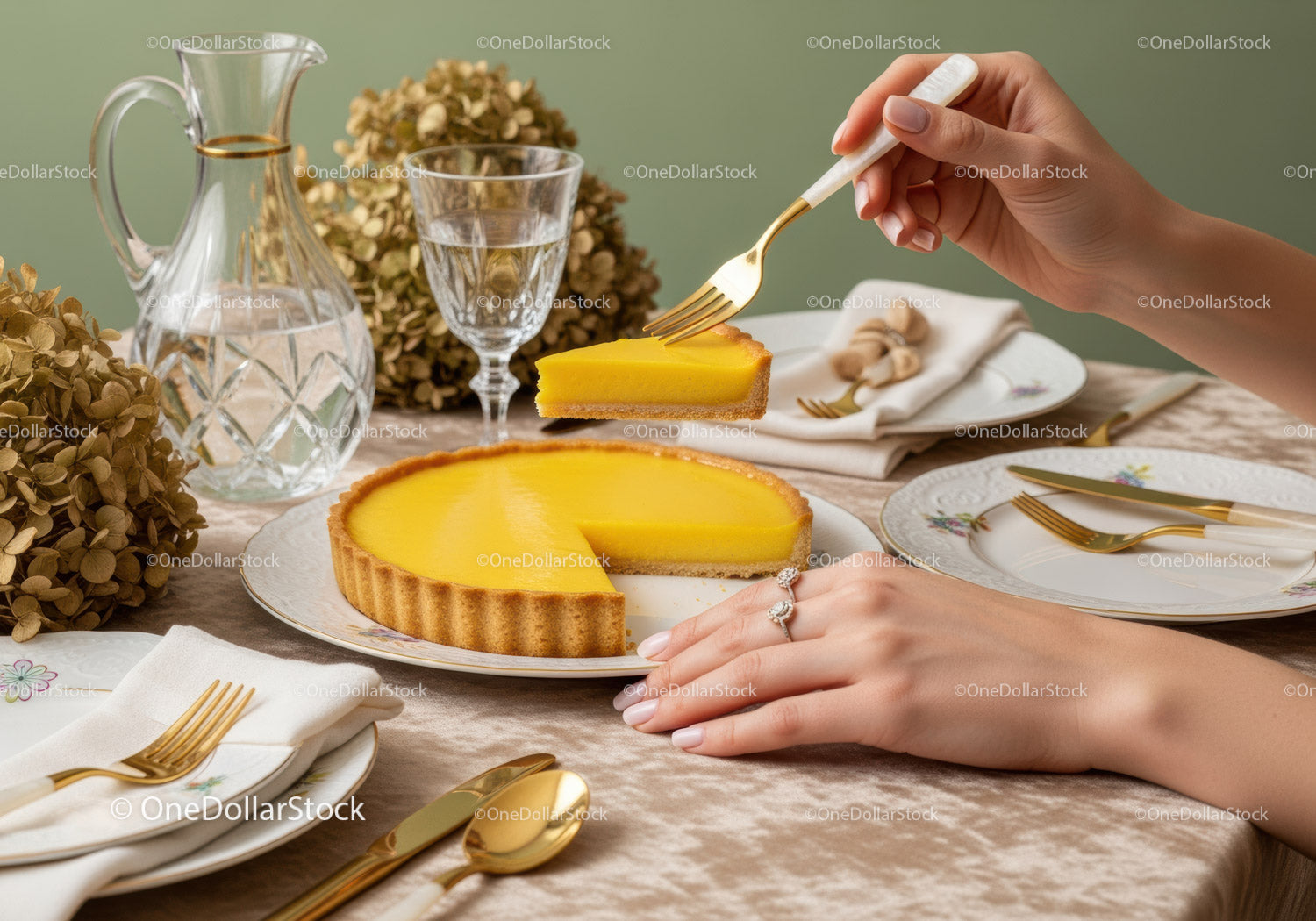 Elegant Lemon Tart Dessert with Gold Cutlery and Vintage Glassware