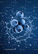Fresh blueberries splashing in clear water droplets