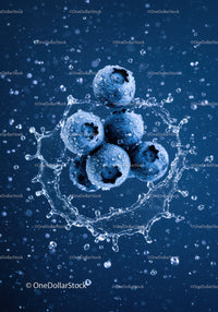 Fresh blueberries splashing in clear water droplets