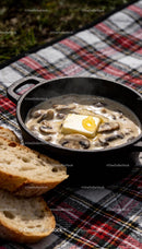 Creamy mushroom sauce with melting butter and bread