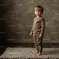 Toddler standing barefoot on textured rug in cozy room
