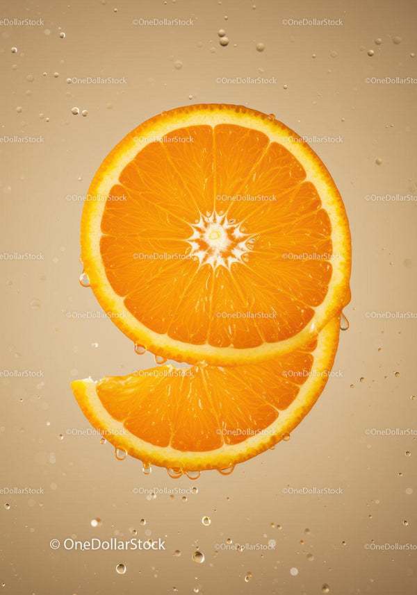 Fresh orange slices immersed in sparkling water