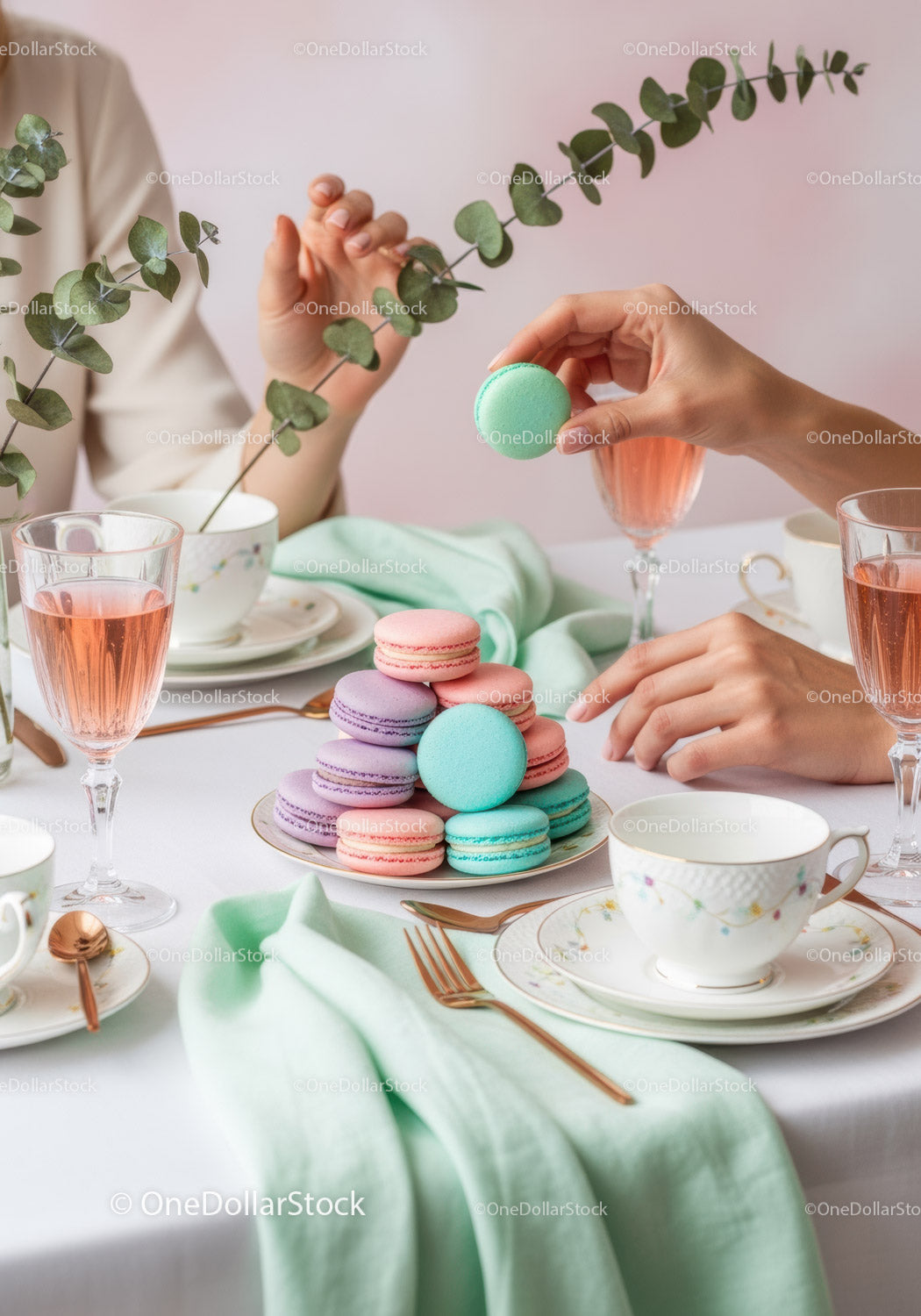 Elegant Tea Party with Colorful Macarons and Floral Decor