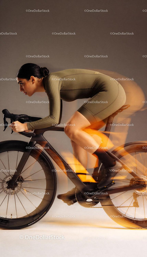 Focused cyclist in dynamic motion on a sleek road bike