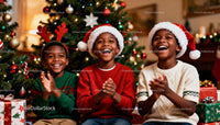 Joyful kids clapping near Christmas tree celebration