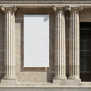Blank Vertical Banner Between Stone Columns on Building