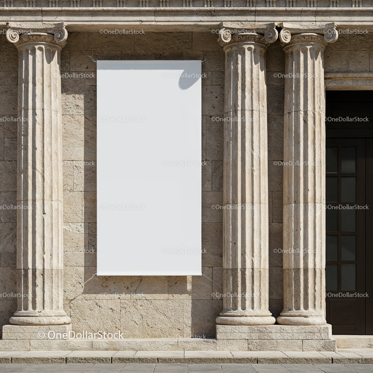 Blank Vertical Banner Between Stone Columns on Building