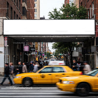 Busy urban street with yellow taxis and pedestrians
