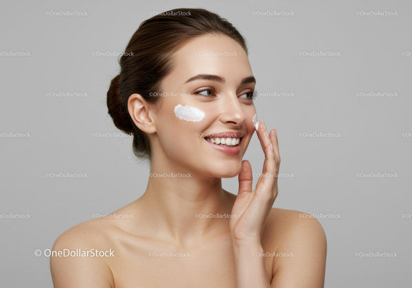 Young Woman Applying Facial Moisturizer for Healthy Glowing Skin
