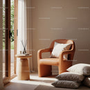 Cozy modern chair with pillows near sunlit window