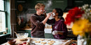 Couple Having Fun Baking Heart-Shaped Cookies Together