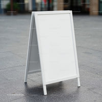 Blank White A-Frame Street Sign on Urban Pavement